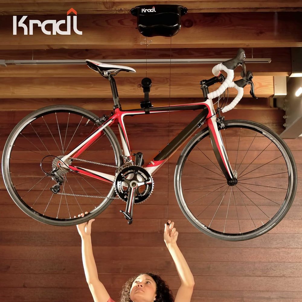 Kradl - Spring-Powered Ceiling Bike Hoist and Rack for Effortless Storage
